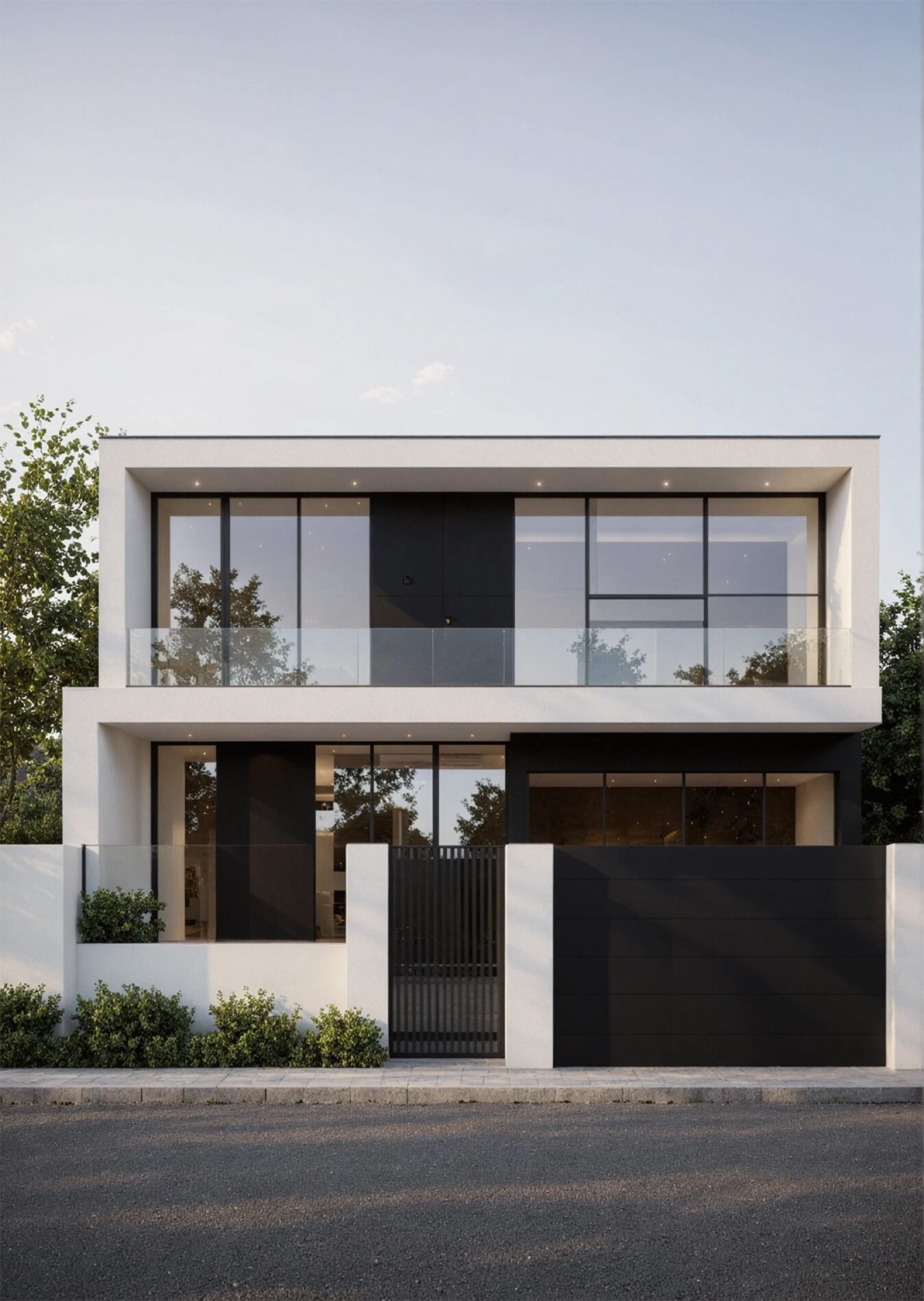 Nowoczesny, geometryczny biały budynek z czarnymi wstawkami, oknami na całej wysokości i czarnym, prostym ogrodzeniem. Projekt: Architekt w Białystok.